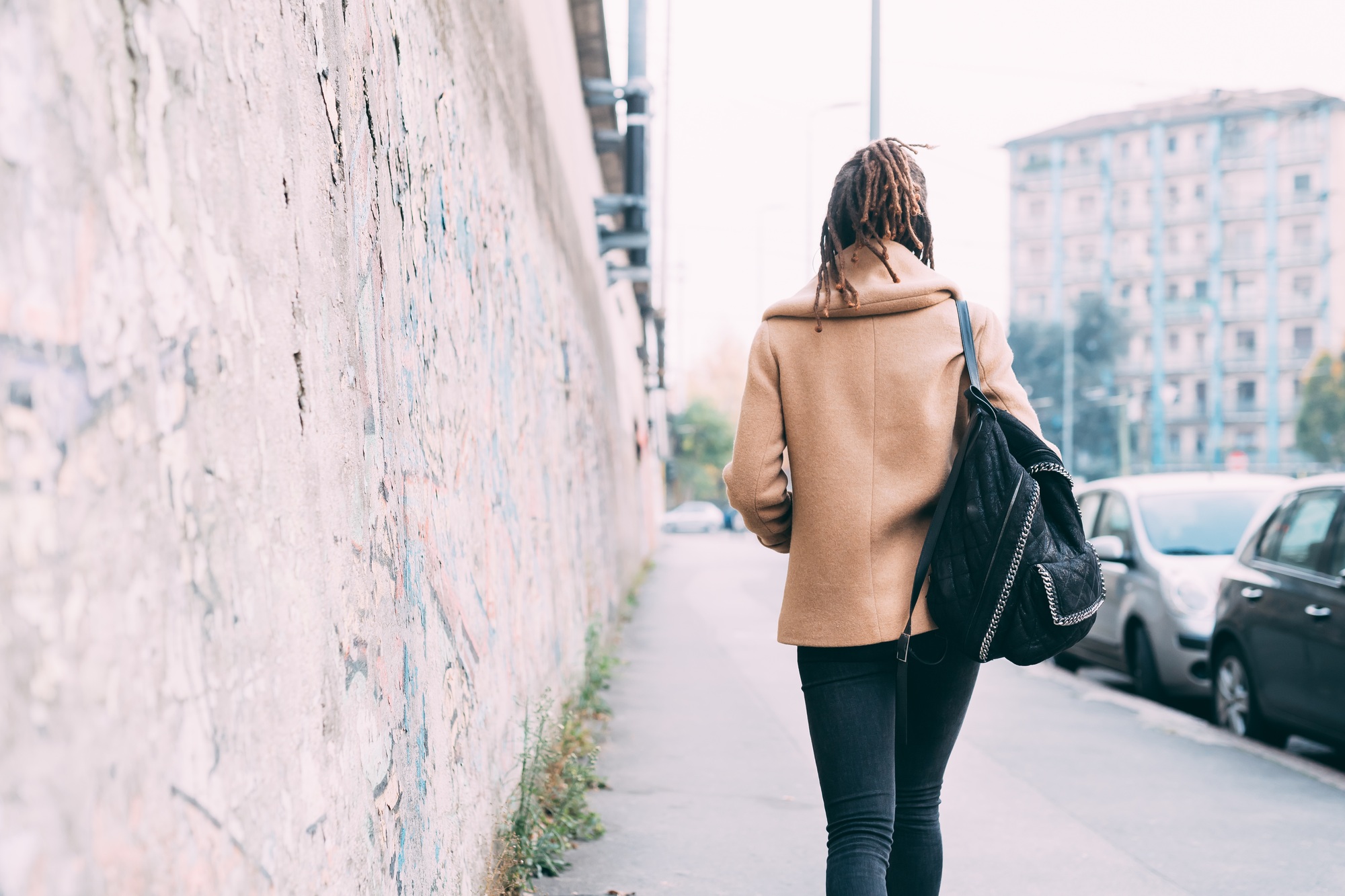 back view young woman walking outdoor