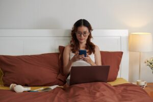 Young Woman Texting Coworkers
